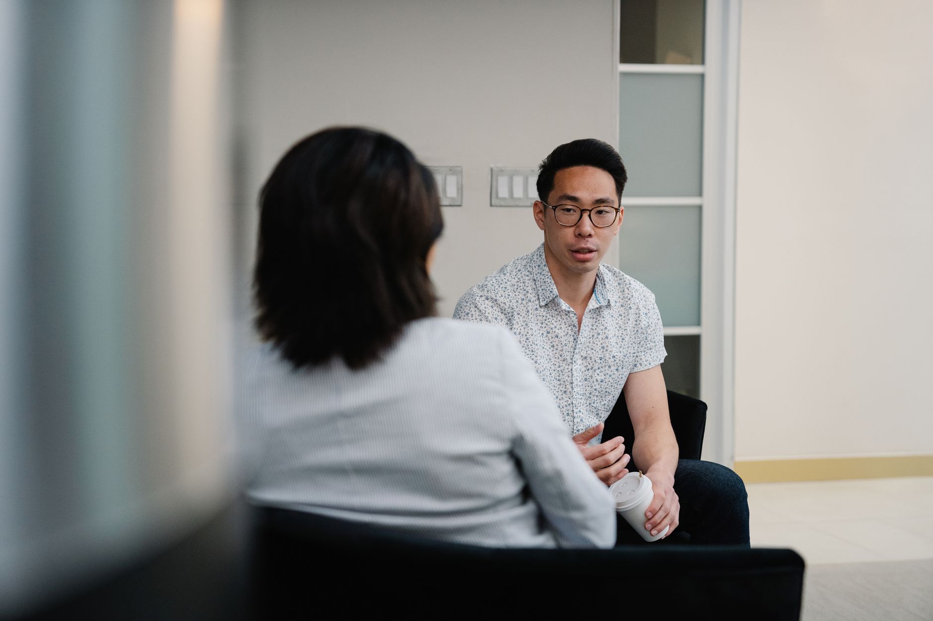 Two professionals in conversation during a job interview